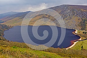 Guiness lake in wicklow mountains in the fog photo