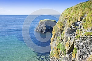 Irish landscape in northern Ireland with blocks of basalt rocks in the sea County Antrim - United Kingdom