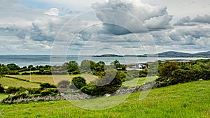 Irish landscape of sea, meadows and farms