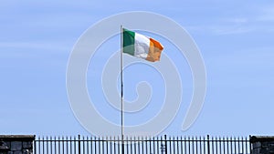 Irish National Flag flying in Carnlough Ireland.xmp