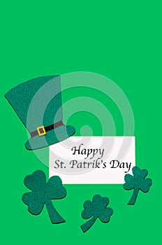 Irish national tradition. St. Patrick`s Day. green hat, leaves of clover, shamrock on background with copy space with inscription