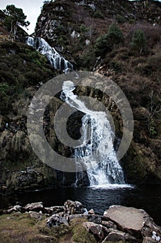 Irish Waterfall along Donegal`s coast as it meets the Atlantic ocean.