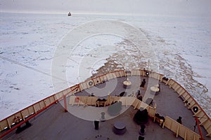 Irizar icebreaker saling across the antarctica, View of the bow of the ship and sea and ice to the horizon photo