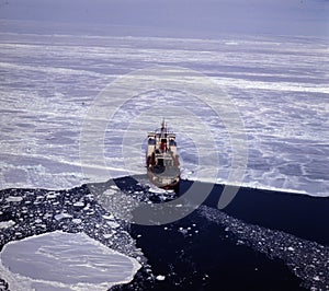 Irizar icebreaker saling across the antarctica, View of the bow of the ship and sea and ice to the horizon. Global warming is photo