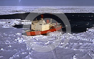 Irizar icebreaker saling across the antarctica, View of the bow of the ship and sea and ice to the horizon. Global warming is photo