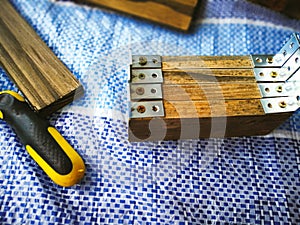 Iron angle brackets attached on the wooden planks.