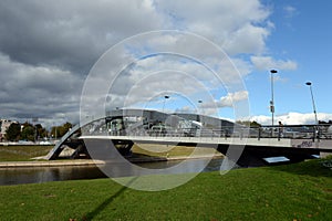 Iron arched Mindaugas Bridge across Neris River in Vilnius