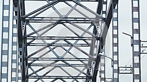 Iron arches of bridge. Bottom view of metal structure. Slow motion.