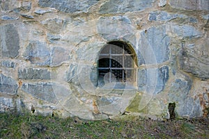 Iron barred window of an old fortress..