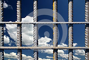 Iron bars on a blue sky