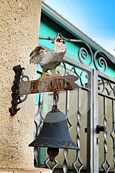 Iron bell doorbell with a rooster at the door