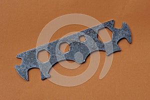 iron bicycle tool on a brown table