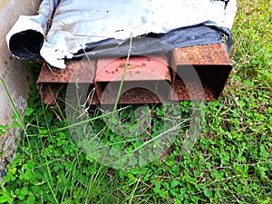 The iron box rusted up. Placed on the lawn outside the house.