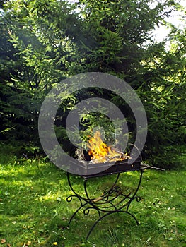 Iron brazier with burning coals