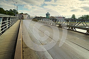 The iron bridge across the river.