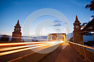 Iron bridge with car light trails