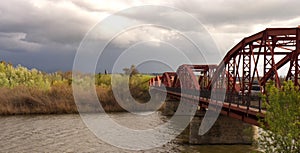 Iron bridge over the river a cloudy day photo