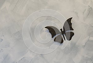 Iron butterflys on cement background