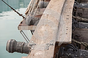 Iron cannon on sail ship