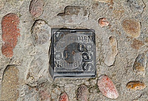 Iron cast hatch of Natural gas on the paving road in Besalu