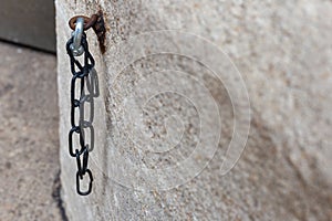 iron chain on ancient church wall