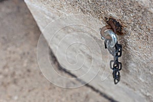 iron chain on ancient church wall