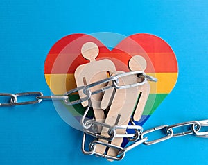 Iron chain figures of people on LGBT rainbow flag