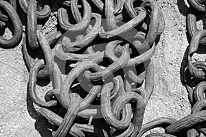 Iron Chain. Iron Chains in a pile on the ground with rust and dirt. Black and White