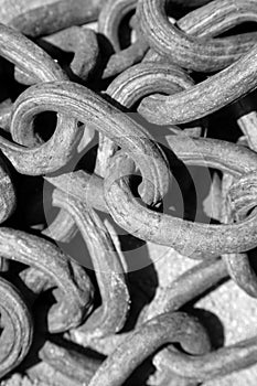 Iron Chain. Iron Chains in a pile on the ground with rust and dirt. Black and White