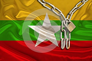 iron chain  a symbol of tyranny  protest against the background of the national flag of Myanmar  the concept of political