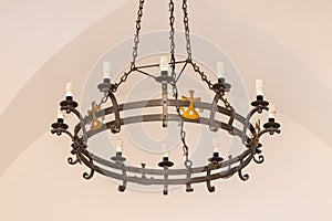 The iron chandelier hanging in interior of the Deir Al-Mukhraqa Carmelite Monastery building  in northern Israel