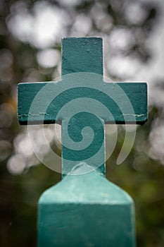 Iron Christian cross on a blurred background photo