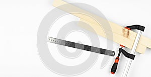 Iron clamps. Tool. Clamps and vices. On a white background. Wooden bars photo