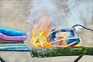 Iron for clothes caught fire on an ironing board