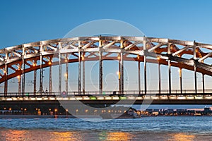 Iron construction Bolsheokhtinsky bridge over the Neva at night in St. Petersburg