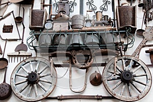 Iron craft tools on a white wall background