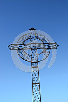 Iron cross against blue sky