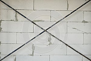 iron cross reinforce and white lightweight concrete wall background