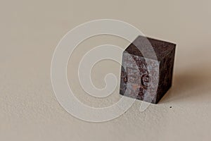 Iron cube with element name Fe on it