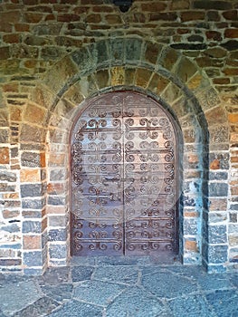 Iron door. Closed door in romanesque style, restaured.