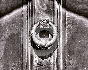 Iron door knocker on wooden door B