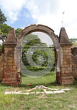 Iron door and stone walls of colonial coffe plantation photo