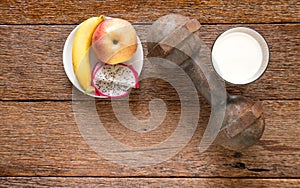 Iron dumbbell and milk with fruit (banana,appke,dragon fruit) o