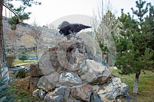 An iron eagle on a stone hill