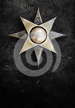 Iron emblem compass windrose star eight tips medallion with polar coordinates on grunge worn background photo