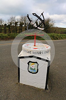 Iron equatorial sundial on concrete pedestal