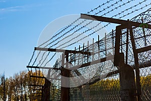 Iron fence with barbed wire