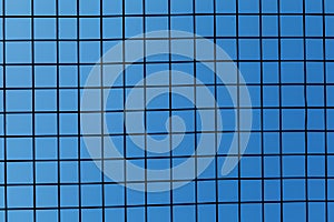 Iron fence on blue sky, mesh fence with blue sky, metal fence and blue sky background behind it