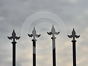 Iron fence details with sky background
