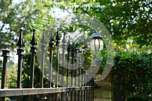 Iron fence and lamp surrounds estate